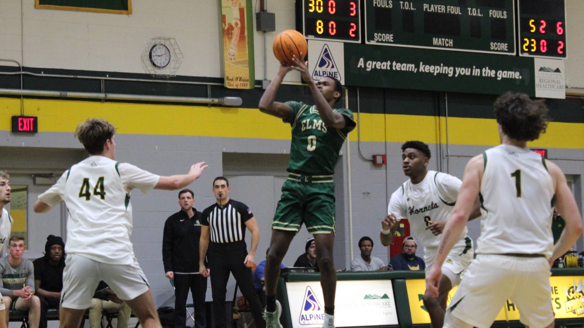 Men's Basketball Dethrones Regis in Conference Matchup